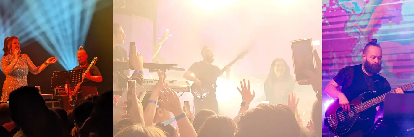 John performing live on stage with a singer and a band in front of a crowd